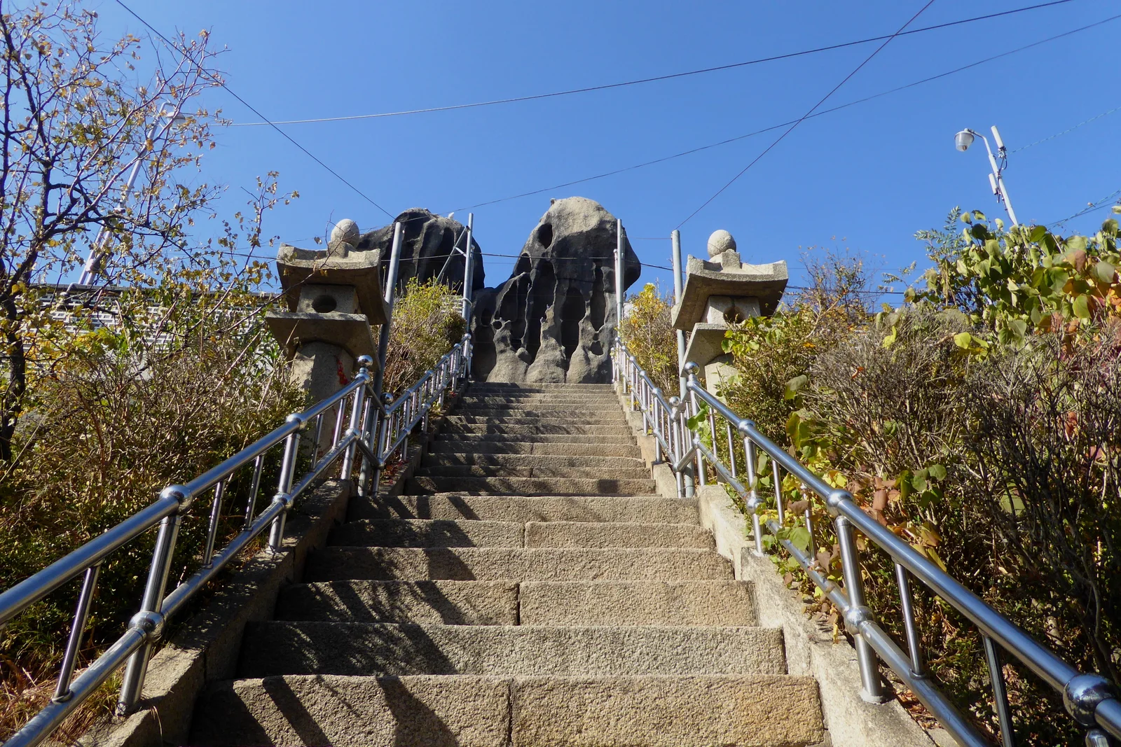 Long stone staircase climbing toward Seonbawi Rock on Inwangsan mountain inside central Seoul